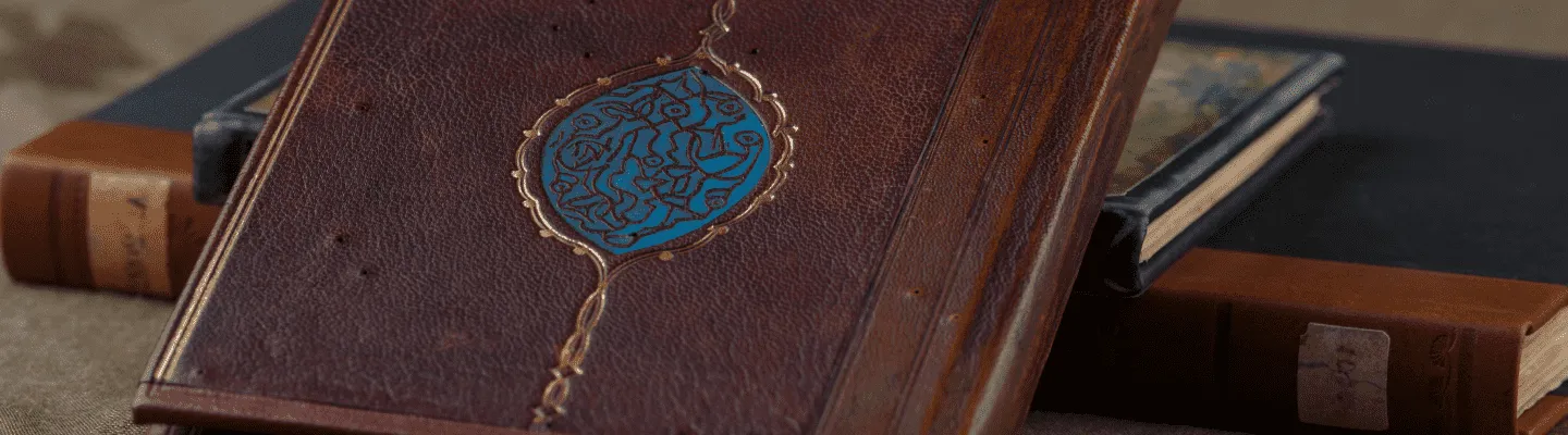 Antique leather-bound book with intricate Middle Eastern design on the cover, symbolizing the cultural heritage of Arabic literature
